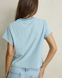 Model wearing the Rhythm Daisy Floral Stripe Tee - Baby Blue on a plain background