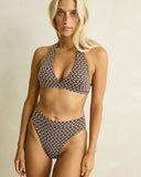 Model wearing the Rhythm Dreamer Halter Top - Chocolate on a plain background