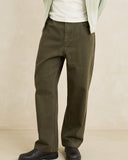 Model wearing the Rhythm Essential Relaxed Straight Jean - Olive on a plain background