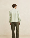 Model wearing the Rhythm Essential Relaxed Straight Jean - Olive on a plain background