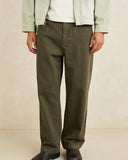 Model wearing the Rhythm Essential Relaxed Straight Jean - Olive on a plain background