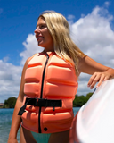 Follow Corp Womens Life Vest in Melon pink front view showing the tailored female-specific panel architecture robust central zip entry closure layout and sleek minimalist brand logo placement, sold by Point Break Cambridge local family surf shop at 63 Duke street.