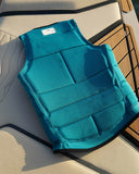 Follow P1 Traction Mens Vest in Emerald green back view showing the ergonomic segmented foam flex panels for maximum spinal movement freedom and clean perimeter line stitching layouts, sold by Point Break Cambridge local family surf shop at 63 Duke street.