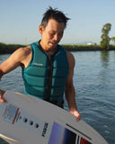 Follow P1 Traction Mens Vest in Emerald green front view showing the smooth tailored panel architecture secure YKK locker zip entry layout and clean sustainable Recycled Chevron Polyester finish, sold by Point Break Cambridge local family surf shop at 63 Duke street.