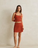 Model wearing the Rhythm Gigi Lace Mini Skirt - Red on a plain background