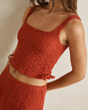 Model wearing the Rhythm Gigi Lace Tie Side Top - Red on a plain background