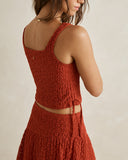 Model wearing the Rhythm Gigi Lace Tie Side Top - Red on a plain background