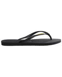 Havaianas Slim Logo Metallic Jandals in Black and Gold side profile view highlighting the comfortable low profile sole thickness and robust strap anchorage points, sold by Point Break Cambridge local family surf shop at 63 Duke street.