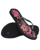 Havaianas Slim Organic Jandals in Black Pink Lemonade 2718 front view showing the elegant open toe thong configuration, vibrant floral print footbed, and delicate slim pink straps, sold by Point Break Cambridge local family surf shop at 63 Duke street.