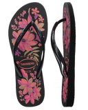 Havaianas Slim Organic Jandals in Black Pink Lemonade 2718 front view showing the elegant open toe thong configuration, vibrant floral print footbed, and delicate slim pink straps, sold by Point Break Cambridge local family surf shop at 63 Duke street.