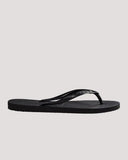 Havaianas Slim SW II Crystal Jandals in Black 0090 side profile view highlighting the comfortable low profile sole thickness and robust strap anchorage points, sold by Point Break Cambridge local family surf shop at 63 Duke street.