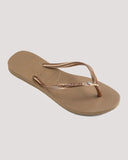 Havaianas Slim SW II Crystal Jandals in Rose Gold 3581 front view showing the elegant open toe thong configuration and delicate slim rose gold straps with sparkling genuine Swarovski crystal embellishment, sold by Point Break Cambridge local family surf shop at 63 Duke street.