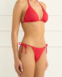 Heaven Cinabar Bella Triangle Top in Red bikini swimsuit side profile view highlighting the comfortable cup alignment, clean red seam construction, and secure side tie anchorage, sold by Point Break Cambridge local family surf shop at 63 Duke street.