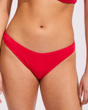 Heaven Jennifer Hipster Pant in Red bikini swimsuit bottoms close up view highlighting the premium smooth stretch swim fabric weave and high quality lined interior stitching, sold by Point Break Cambridge local family surf shop at 63 Duke street.