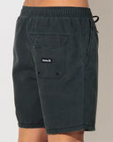 Hurley Beach Staple Boardshort in Black close up view highlighting the premium quick-dry stretch fabrication weave fabric texture precise surf-tie grommet stitching and stitched brand logo accents, sold by Point Break Cambridge local family surf shop at 63 Duke street.