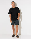 Hurley Beach Staple Boardshort in Black front view showing the tailored fixed waistband structured performance swim short profile functional drawcord closures and clean coastal activewear lines, sold by Point Break Cambridge local family surf shop at 63 Duke street.