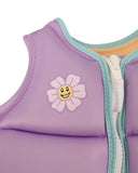 Jetpilot Freeride Girls Youth Eco Vest in Purple close up view highlighting the premium Ecoprene fabric texture, durable YKK front zipper, detailed stitch-through panel construction, vibrant purple gradient print and signature Jetpilot branding, sold by Point Break Cambridge local family surf shop at 63 Duke Street.