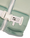 Jetpilot Freeride Girls Youth Eco Vest in Teal close up view highlighting the premium Ecoprene fabric texture, durable YKK zipper, detailed stitch-through panel construction, distinctive teal and white floral design and signature Jetpilot branding, sold by Point Break Cambridge local family surf shop at 63 Duke Street.