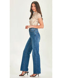 Side view of the women's Junkfood Anastasia wide-leg jeans in classic blue denim showing the high-rise waist.