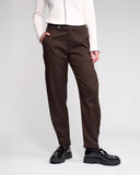 Brown pants worn by a person on a white background