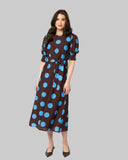 Leila + Luca Gathering Dress in Bold Blue Spot front view showing the elegant relaxed midi length silhouette flattering tailored neckline and clean casual flowing lower polka dot print hemline profile, sold by Point Break Cambridge local family surf shop at 63 Duke street.