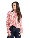 Leila + Luca New York Top in Ruby Pop colour long sleeve blouse close up view highlighting the premium fabric texture and wrist cuff details, sold by Point Break Cambridge local family surf shop at 63 Duke street.