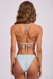 A woman shown from the back wearing a light blue and white gingham bikini with tie-back straps, set against a plain light gray studio background.