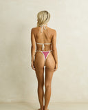 Model wearing the Rhythm Lola Check Slide Tri Top - Plum