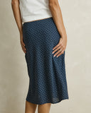 Model wearing the Rhythm Maisy Midi Skirt - Blue on a plain background