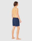 Oakley Beach Volley 16 inch Beachshort in Abyss blue side profile view showing the modern active outseam hemline and comfortable relaxed leg opening architecture, sold by Point Break Cambridge local family surf shop at 63 Duke street.