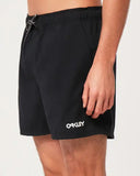 Oakley Beach Volley 16 inch Beachshort in Blackout matte black side profile view showing the modern active outseam hemline and comfortable relaxed leg opening architecture, sold by Point Break Cambridge local family surf shop at 63 Duke street.