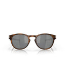Oakley Latch Sunglasses in Matte Brown Tortoise front view showing the classic round lifestyle frame layout keyhole bridge structure and premium color-tuning Prizm Black lenses, sold by Point Break Cambridge local family surf shop at 63 Duke street.