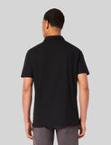 Oakley Relax Urban Polo Shirt in Blackout back view showing the relaxed straight silhouette and premium shoulder stitching, sold by Point Break Cambridge local family surf shop at 63 Duke street.