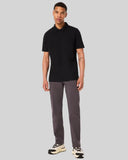 Oakley Relax Urban Polo Shirt in Blackout front view showing the short sleeve profile and tonal embroidered chest logo, sold by Point Break Cambridge local family surf shop at 63 Duke street.