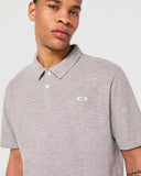 Oakley Relax Urban Polo Shirt in New Granite Heather grey close up view highlighting the premium textured heather fabric weave, ribbed collar, and branded two button placket, sold by Point Break Cambridge local family surf shop at 63 Duke street.