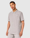 Oakley Relax Urban Polo Shirt in New Granite Heather grey front view showing the short sleeve profile and tonal embroidered chest logo, sold by Point Break Cambridge local family surf shop at 63 Duke street.
