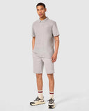 Oakley Relax Urban Polo Shirt in New Granite Heather grey front view showing the short sleeve profile and tonal embroidered chest logo, sold by Point Break Cambridge local family surf shop at 63 Duke street.