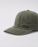 Oakley Tinfoil 3.0 LX Cap in New Dark Brush olive close up view highlighting the premium textured fabric panels raised metal badge anchorage and internal performance sweatband tape detailing, sold by Point Break Cambridge local family surf shop at 63 Duke street.