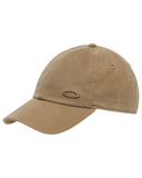 Oakley Tinfoil 3.0 LX Cap in Pebble tan front view showing the structured six panel crown curved brim and custom metallic front brand icon badge, sold by Point Break Cambridge local family surf shop at 63 Duke street.