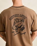 Model wearing the Rhythm Peace Sun Ringer Vintage SS T-Shirt - Oak on a plain background