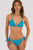 Woman wearing a blue bikini against a white background
