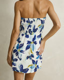 Model wearing the Rhythm Posie Mini Dress - Blue on a plain background