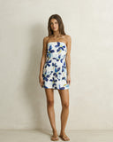 Model wearing the Rhythm Posie Mini Dress - Blue on a plain background