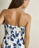 Model wearing the Rhythm Posie Mini Dress - Blue on a plain background