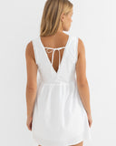 Model wearing the Rhythm Presley Dress - Off White on a plain background