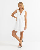 Model wearing the Rhythm Presley Dress - Off White on a plain background