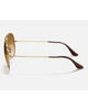 Ray-Ban Aviator Gradient Sunglasses in Polished Arista Gold side profile view highlighting the ultra thin lightweight temple arms and subtle laser engraved classic script Ray-Ban brand signature on the lens border, sold by Point Break Cambridge local family surf shop at 63 Duke street.
