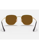 Ray-Ban Hexagonal Flat Lenses Sunglasses in Polished Arista Gold back view showing the smooth minimalist hexagonal gold metal frame architecture adjustable crystal nose pads and clear temple ear tip sleeves, sold by Point Break Cambridge local family surf shop at 63 Duke street.