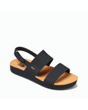 Top diagonal view of Reef Water Vista sandals in Black/Tan showing the flexible dual-strap design.
