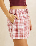Rhythm Chelsea Check Skort in Plum purple side profile view highlighting the clean hemline cut and comfortable low profile side seam construction, sold by Point Break Cambridge local family surf shop at 63 Duke street.